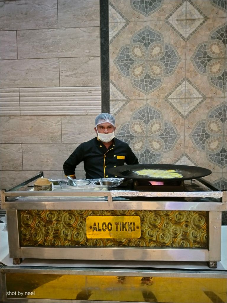 Mithila Events staff serving guests at an evening event in Noida