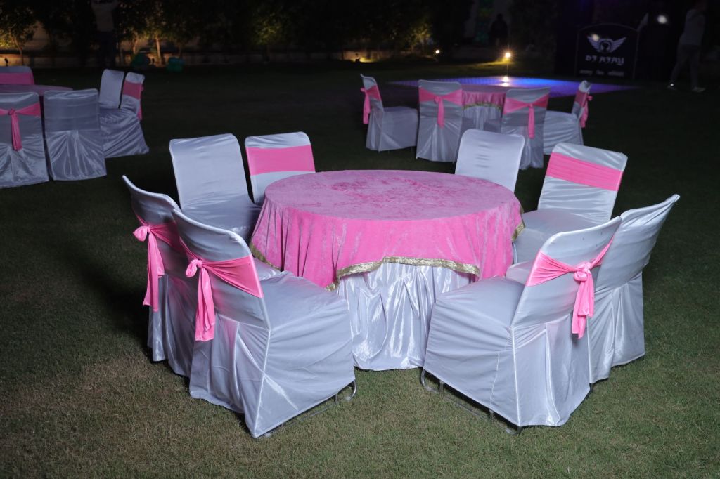 Round table and chair seating arrangement for a birthday party in Noida by Mithila Events
