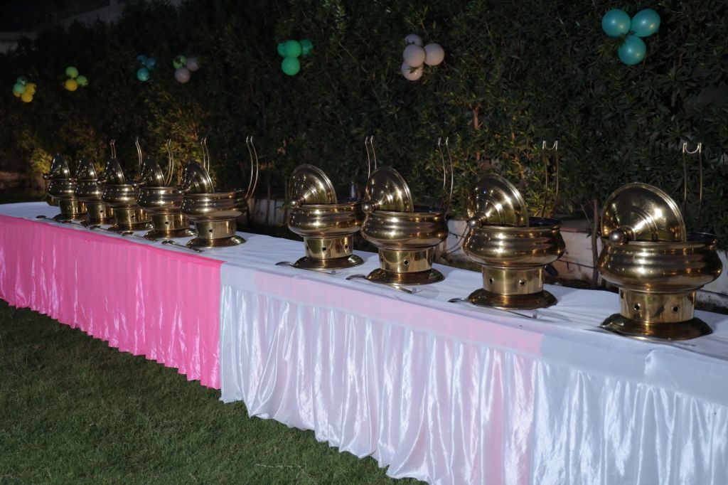Buffet catering setup at a farmhouse birthday party in Noida by Mithila Events