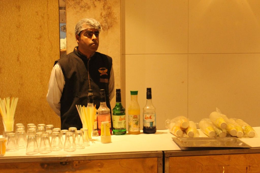 Mithila Events catering staff at a buffet service in a banquet hall