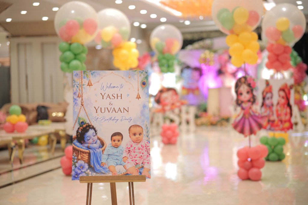 Pastel balloon decoration with welcome board at a family function in Noida