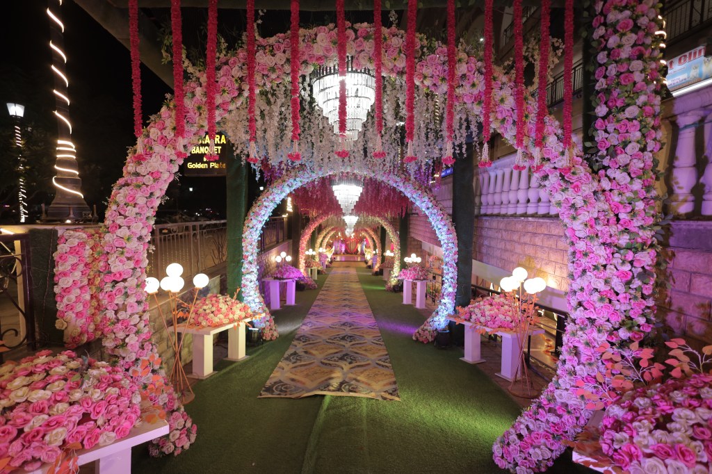Pink floral entrance arch for a wedding function in Noida