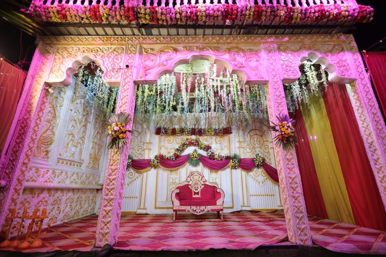 Pink floral stage decoration for a wedding in Noida
