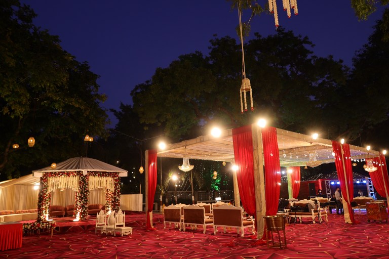 Lawn lighting at an evening function in Noida by Mithila Events