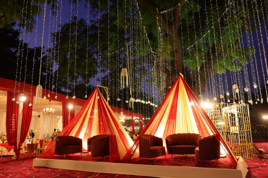 Wedding venue lit up at night at a farmhouse function in Noida