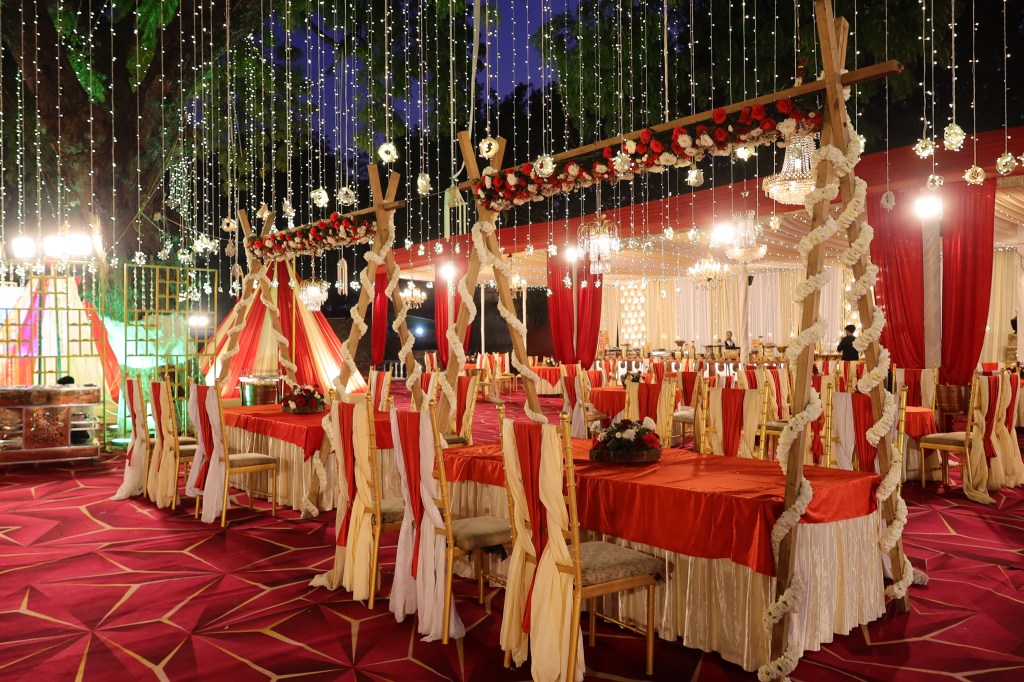Garden venue lit with fairy lights for an evening wedding function