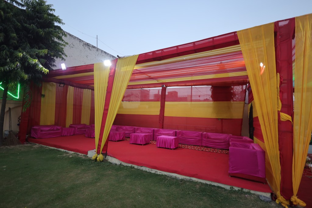Pink and gold tent setup for a haldi function in Kavi Nagar, Ghaziabad